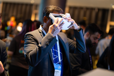 Attendees looking at board