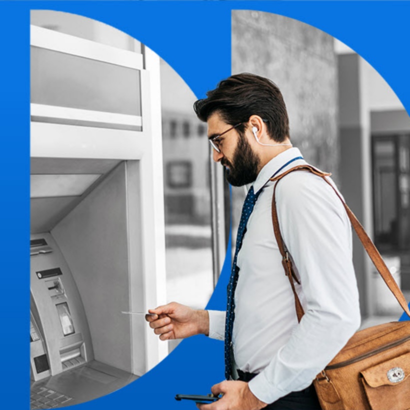 Person using an outdoor ATM machine