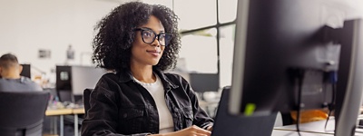 Businesswoman working on the computer at her desk.
