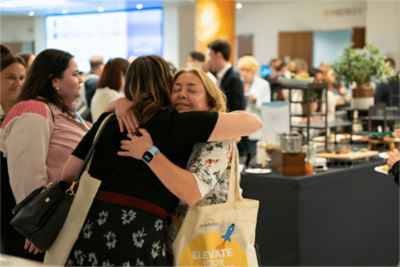 Two women meeting up on the Elevate event