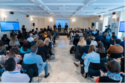 Attendees watching speech