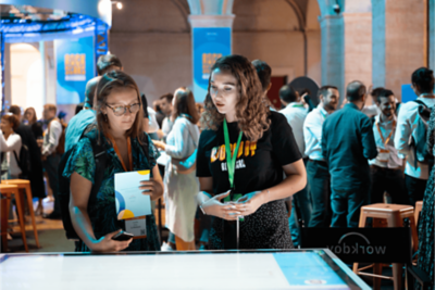 Two women discussing the information on the screen