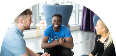 Happy teammates conversing.