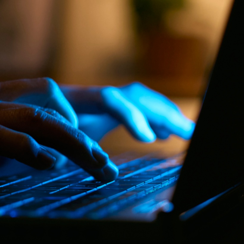 person typing on a laptop