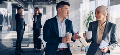 Two people walking and talking.