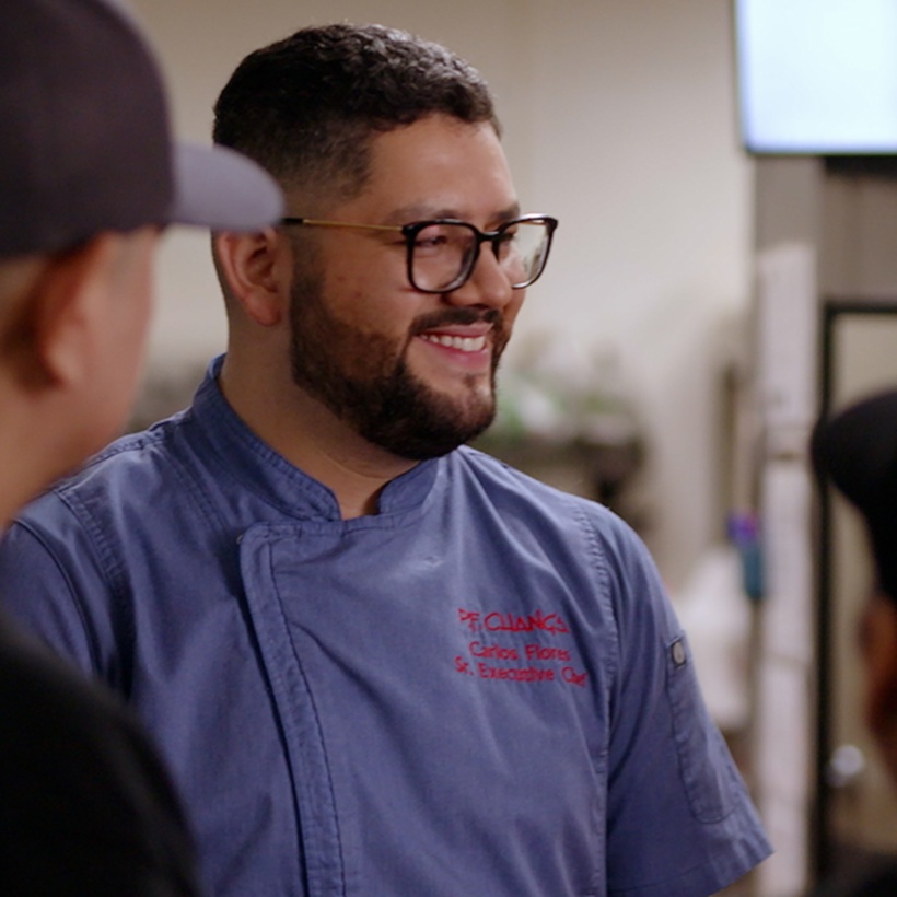 P.F. Chang's employees working together in a restaurant kitchen