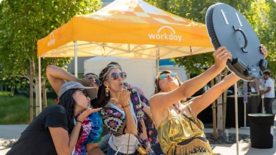 Workday teammates having fun, taking photos for instagram.