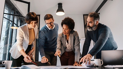 Four people collaborating