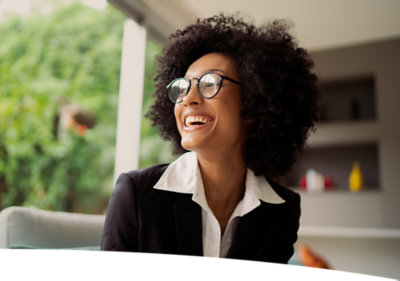 woman with glasses smiling
