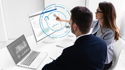 People analyzing financial dashboards.