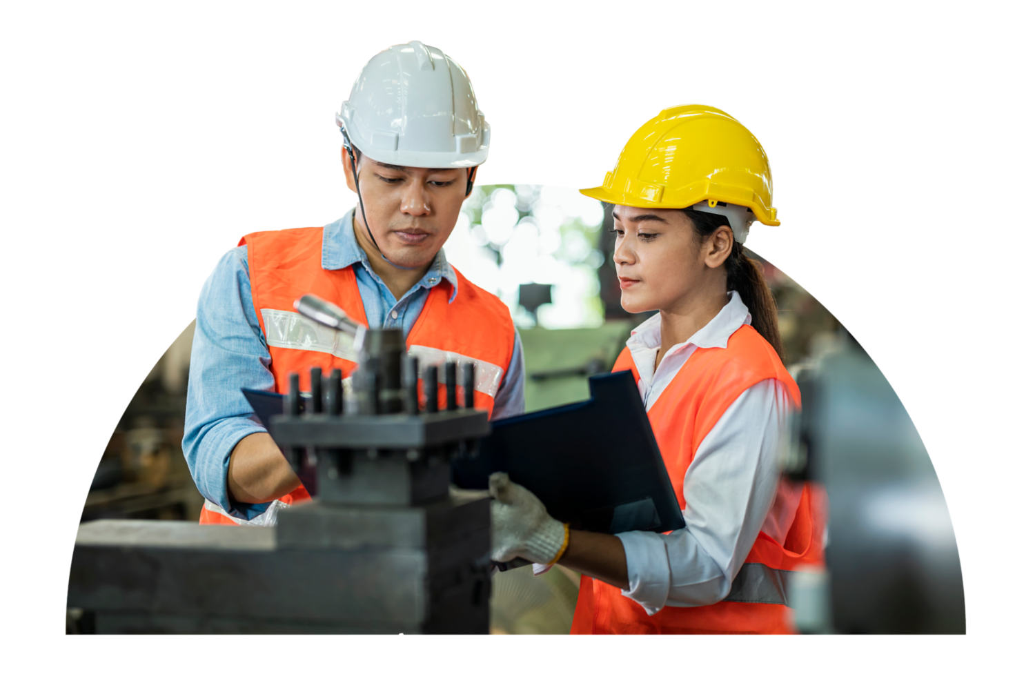 Two manufacturing employees looking over a plan.