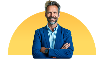 Man in a blue suit standing with his arms crossed.