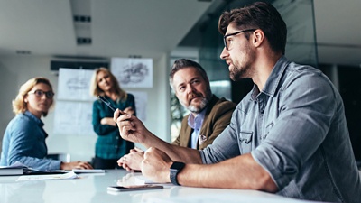 Image of people discussing and collaborating. 