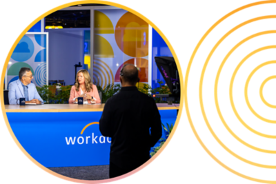 Person focusing in front of a monitor array.