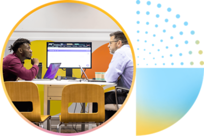 Engaged attendees with laptops open and ready.