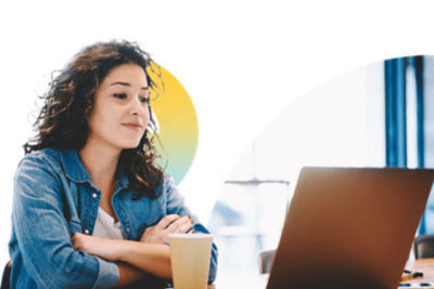 Attendee in deep thought while in front of an illuminated laptop.