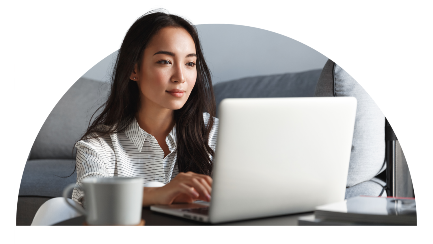 Woman looking at laptop.