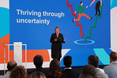 Women having speech on stage