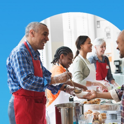 Industry Outlook image: People working in a volunteer setting handing out food