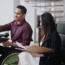 Two office workers in meeting.