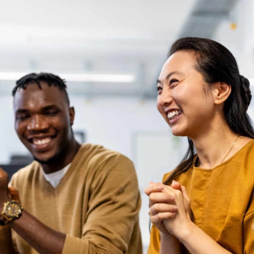 happy colleagues in an office together