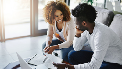 Man and woman looking at data on device