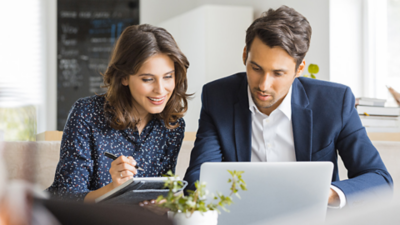 Man and woman looking at data on device