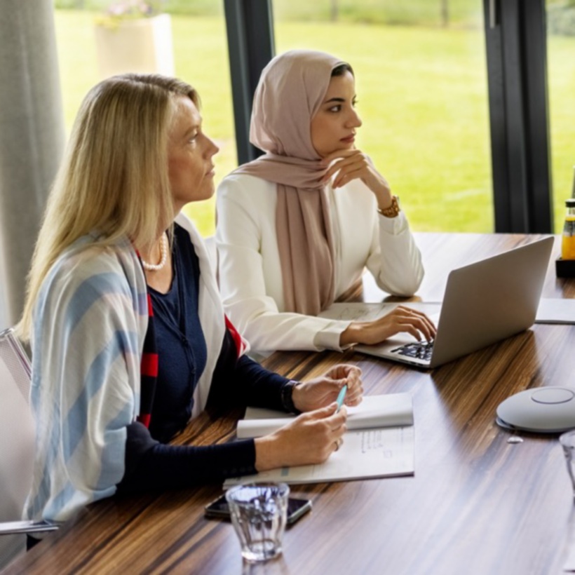 office workers meeting in an open workspace